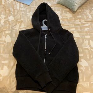 fluffy black zip up